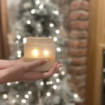 Lighted soy candle in frosted jar